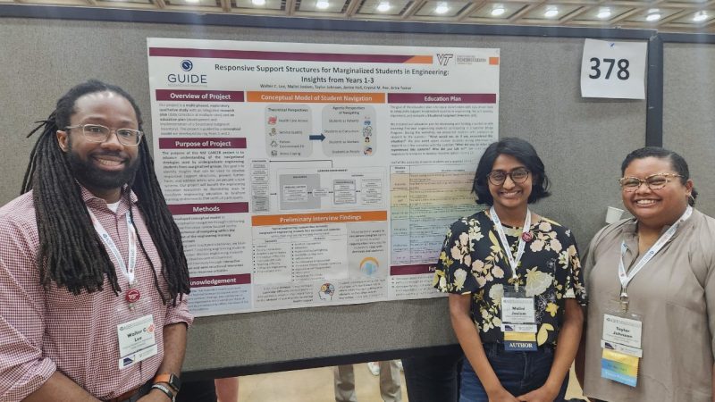 Walter Lee, Malini Josiam and Taylor Johnson stand in front of their research poster.