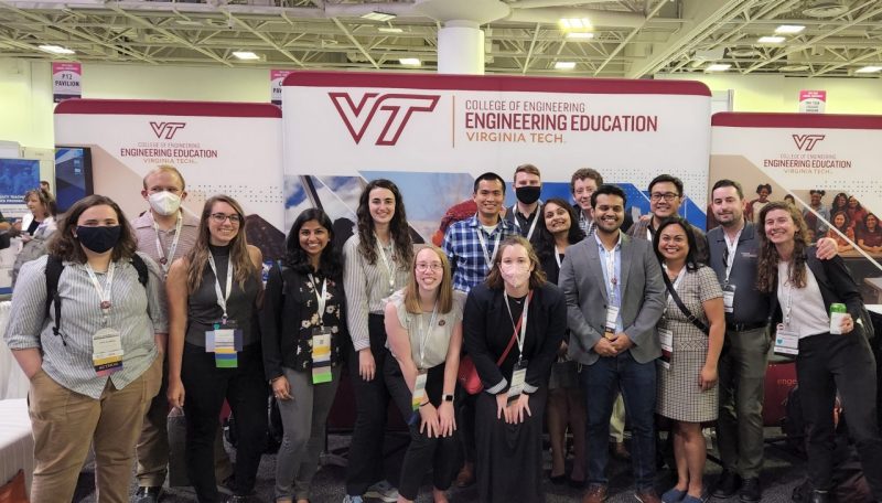 Engineering Education graduate students and Ph.D. alumni smiling together at the 2022 ASEE conference
