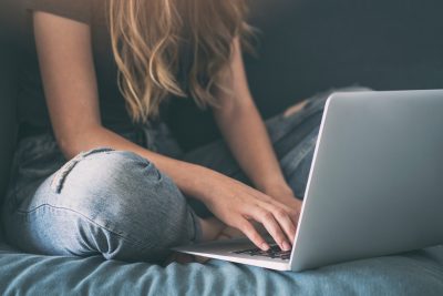 teen girl on lap top